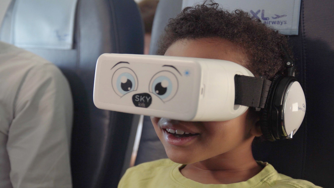 Child wearing VR headset on a plane